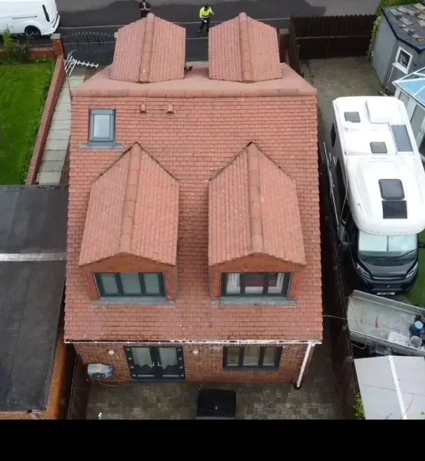 Clean red tiled roof after moss removal