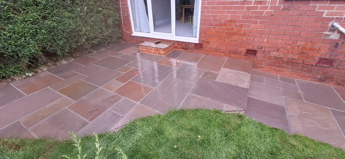 Restored patio slabs after pressure washing